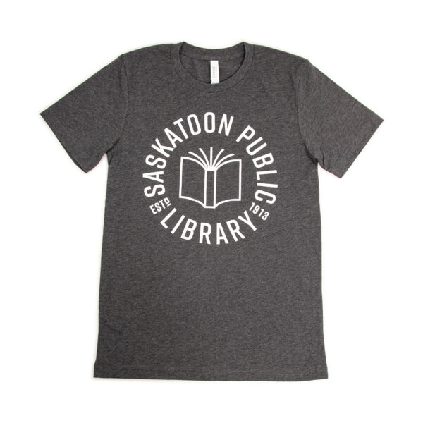 A grey t-shirt with Saskatoon Public Library est. 1913 and an outline drawing of a book.