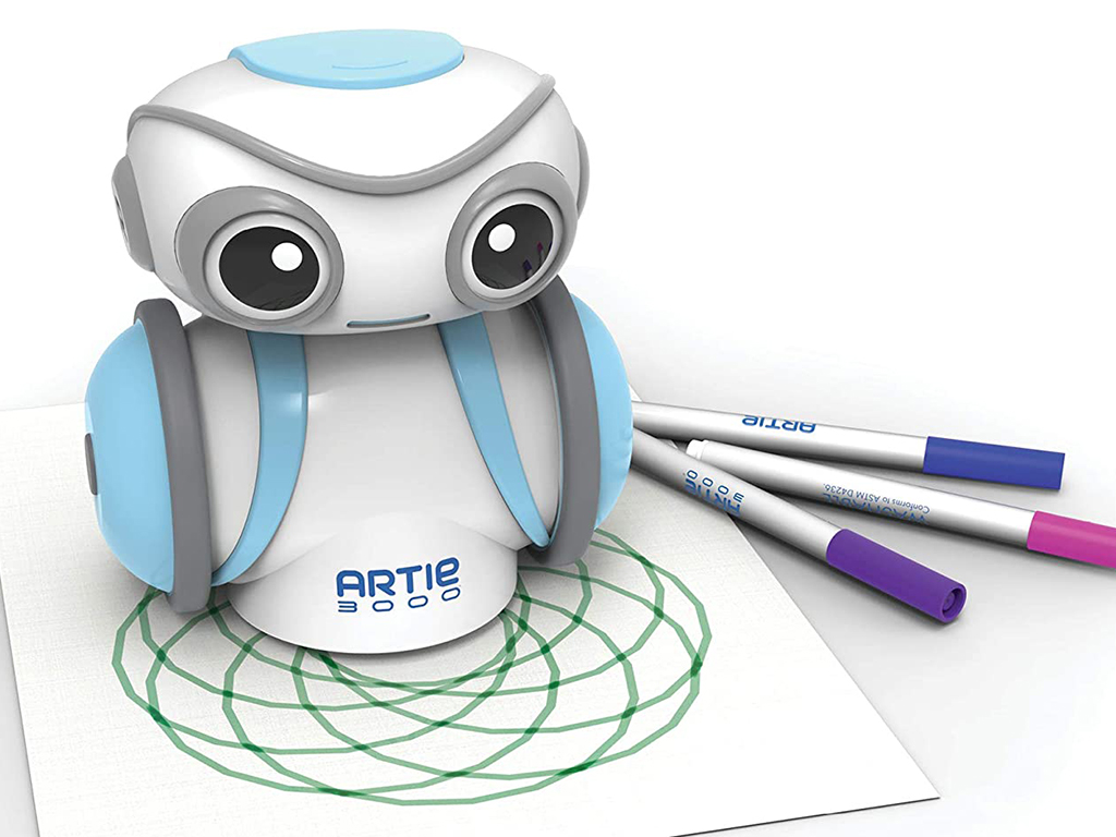 The Artie 3000 coding robot sits on a piece of paper with a drawing and some markers.