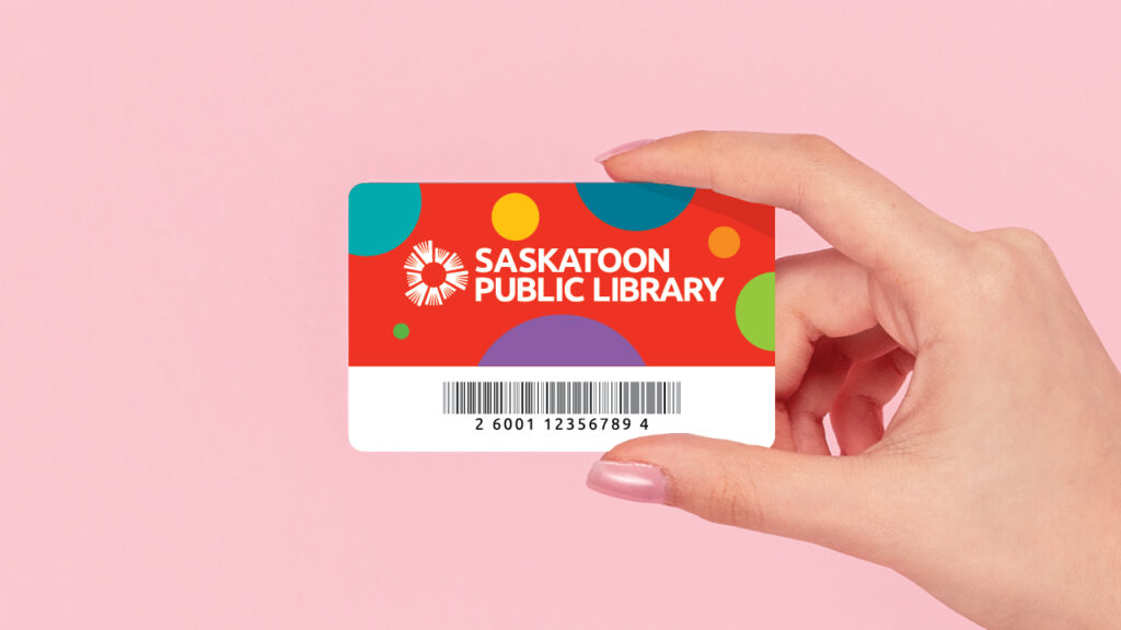 hand holding youth library card